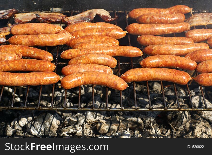 Tasty fresh sausages on the barbecue