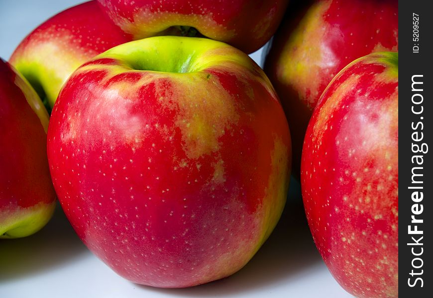 A small pile of fresh green and red apples