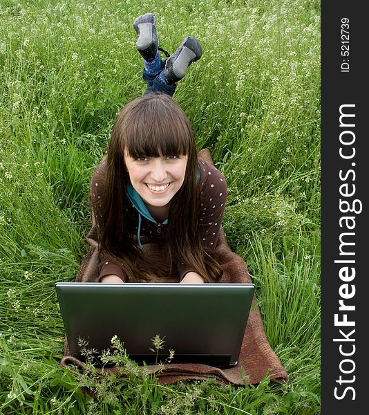 Happy girl with laptop outdoor