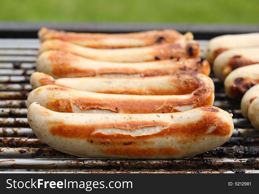 Roasted sausages on the grill. Roasted sausages on the grill.