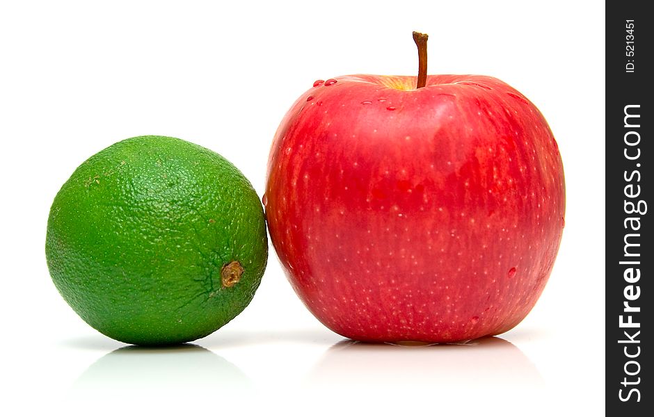 Red apple and green kiwis on the white background. Isolated. Shallow DOF. Red apple and green kiwis on the white background. Isolated. Shallow DOF.