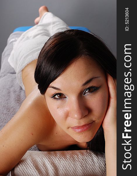 Attractive brunette woman relaxing in massage