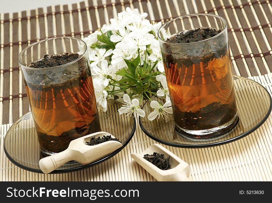 Fruit tea cup and dried tea leaves. Fruit tea cup and dried tea leaves