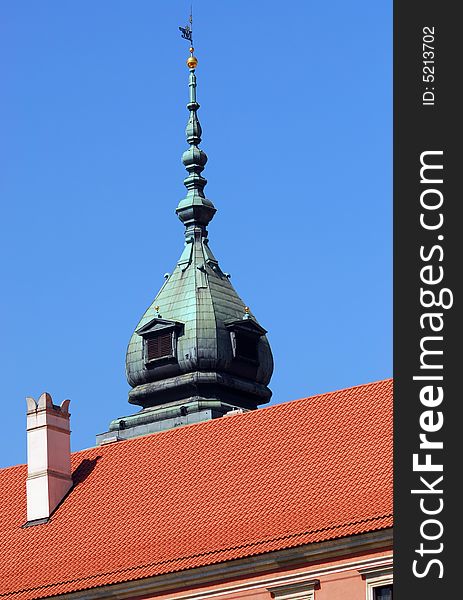 Pinnacle and roof of the Royal Palace in Warsaw. Clear blue sky.