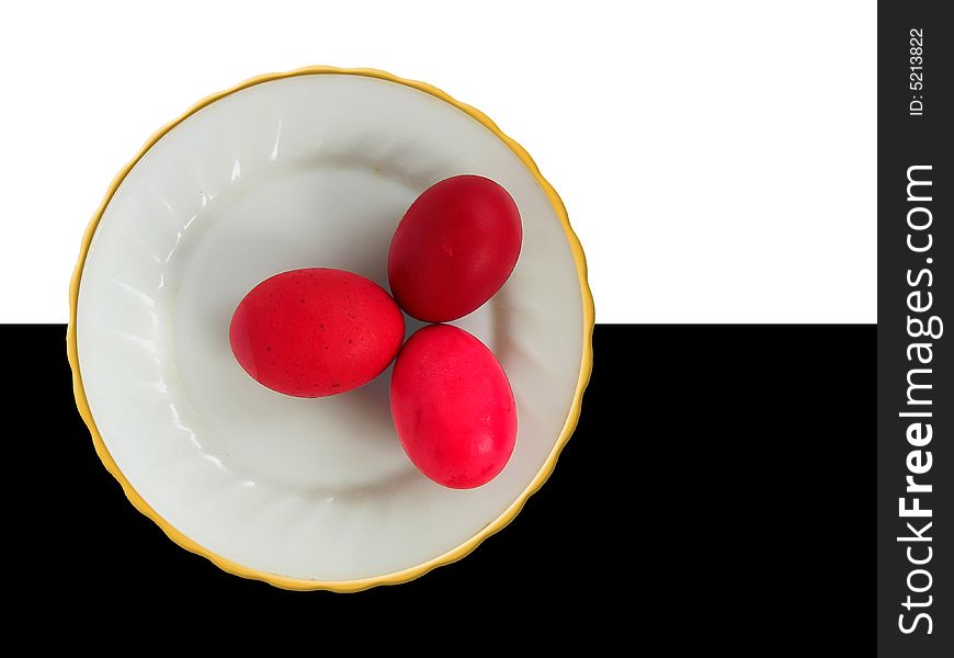 Three red easter eggs on a plate. Three red easter eggs on a plate