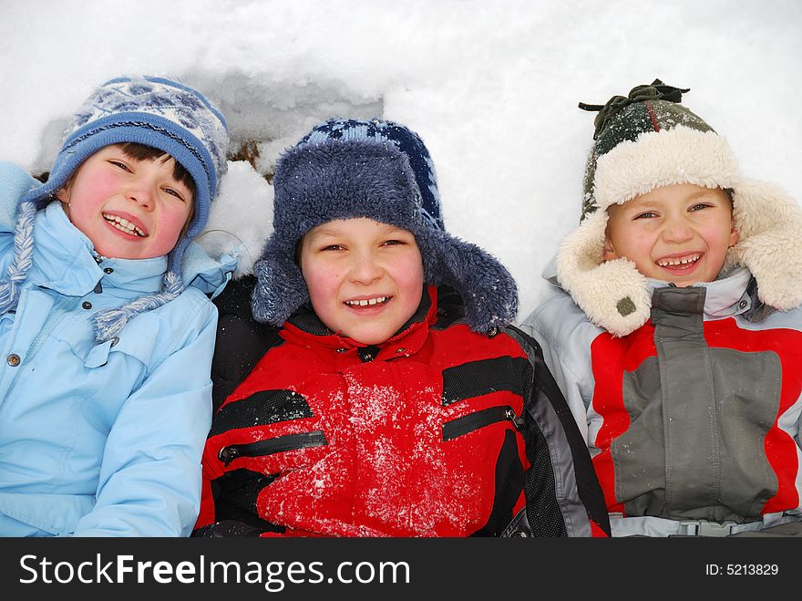 Children Laying In Snow