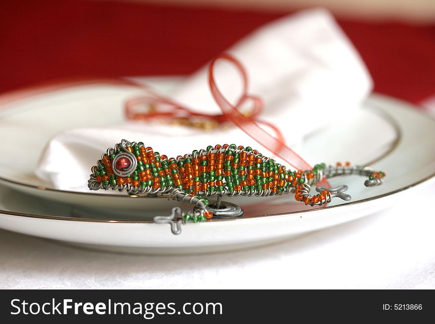 Wire and bead fridge magnet used on a place setting. Wire and bead fridge magnet used on a place setting.