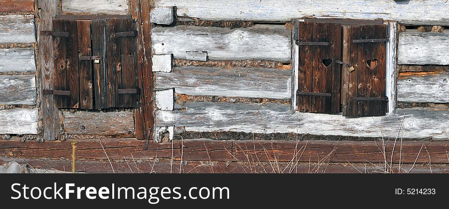 Closed windows with old rust padlock. Closed windows with old rust padlock