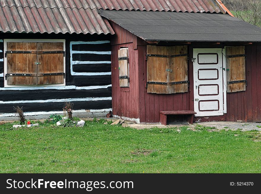 Old house ,closed woody door, windows with padlocks. Old house ,closed woody door, windows with padlocks