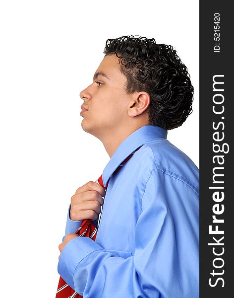 Sideview of young business man fixing his tie. Sideview of young business man fixing his tie