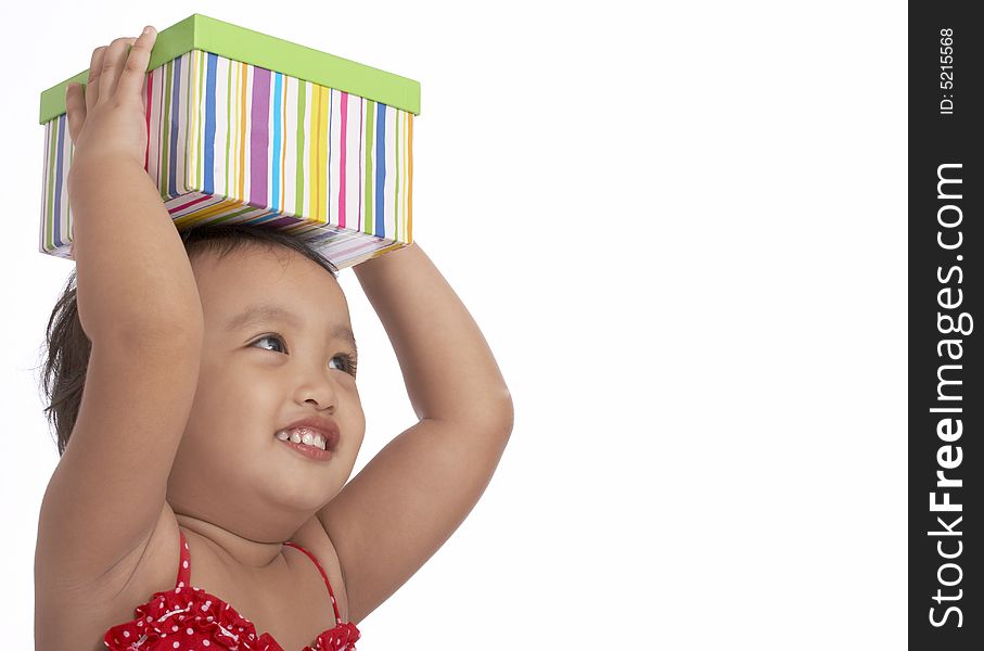 Cheerful child holding a green stripes box