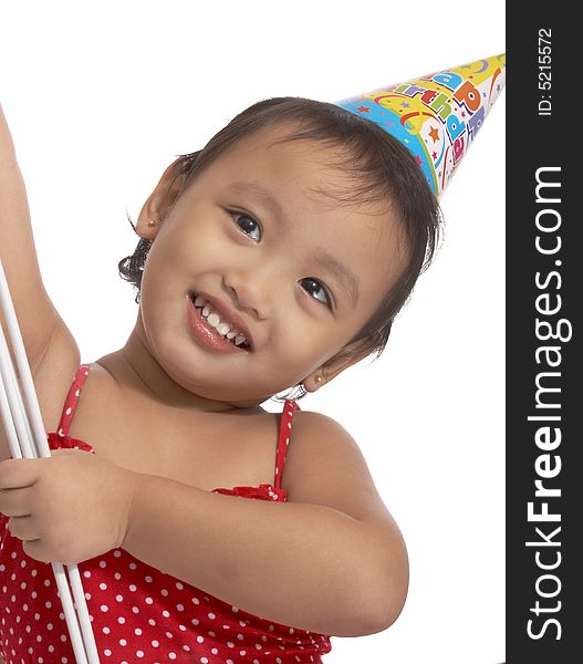 Girl with party hat on red top