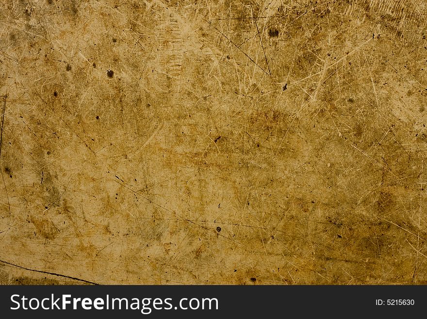 A background of brown and tan particle board fibers. A background of brown and tan particle board fibers.