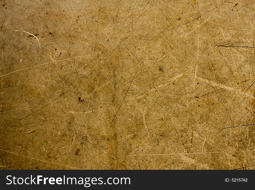 A background of brown and tan particle board fibers. A background of brown and tan particle board fibers.