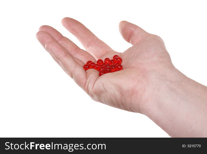 Hand with red pills.  Isolated on white [with clipping path]. Hand with red pills.  Isolated on white [with clipping path].