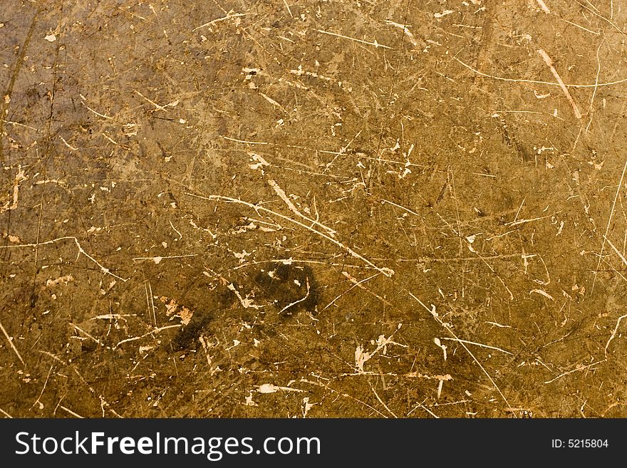 A background of brown and tan particle board fibers. A background of brown and tan particle board fibers.