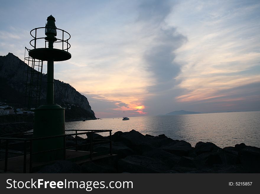 Capri view lighthouse at sunset