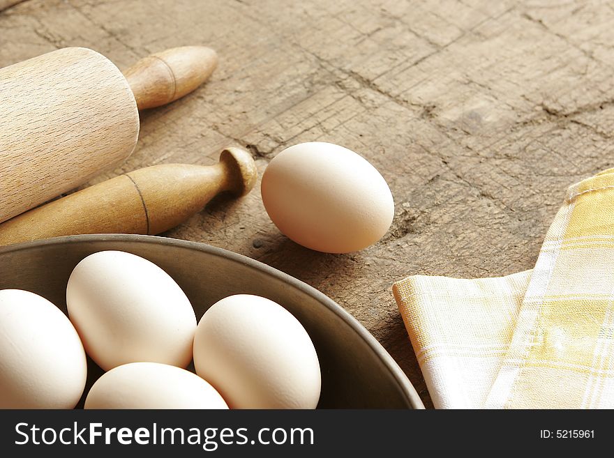Fresh eggs and rolling pin
