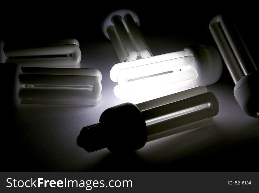 Efficient power saving fluorescent bulb on black. Efficient power saving fluorescent bulb on black