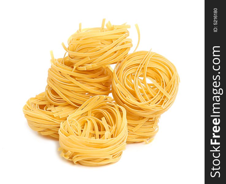 Italian pasta tagliatelle isolated on white. Italian pasta tagliatelle isolated on white