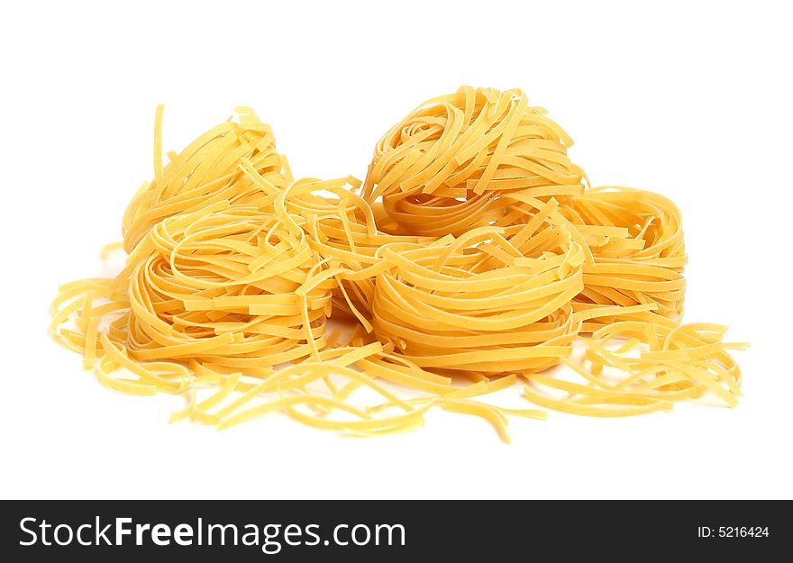 Italian pasta tagliatelle isolated on white. Italian pasta tagliatelle isolated on white