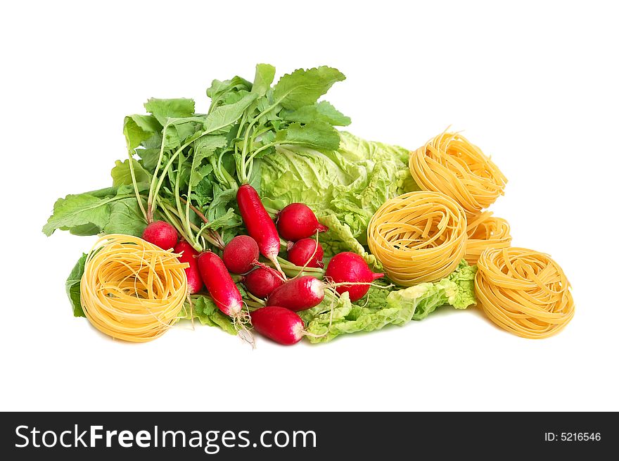 Italian pasta tagliatelle, radish and chinese lettuce leaves isolated on white. Italian pasta tagliatelle, radish and chinese lettuce leaves isolated on white