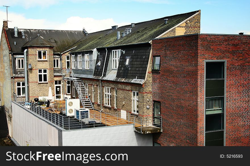 Flats or apartments. Urban building in brick. home with rooftop garden or terrace. Flats or apartments. Urban building in brick. home with rooftop garden or terrace