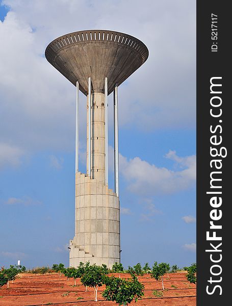 Water tower from concrete in form of the torchlight