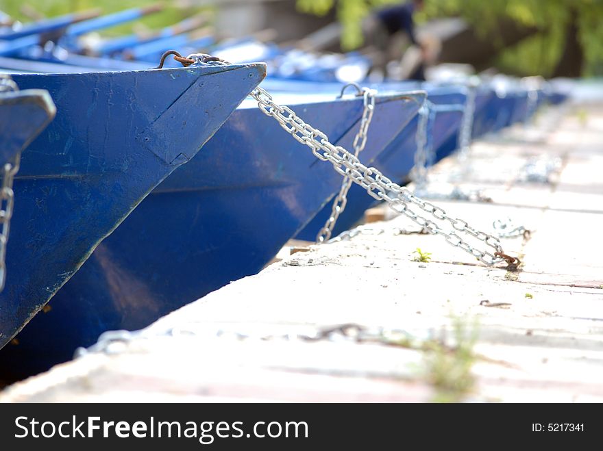 Blue boats at the dock in Herastrau Park,  Bucharest. Blue boats at the dock in Herastrau Park,  Bucharest