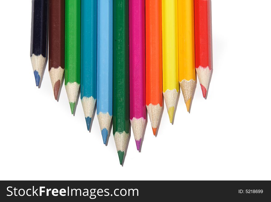 Crayons lies in row on white background