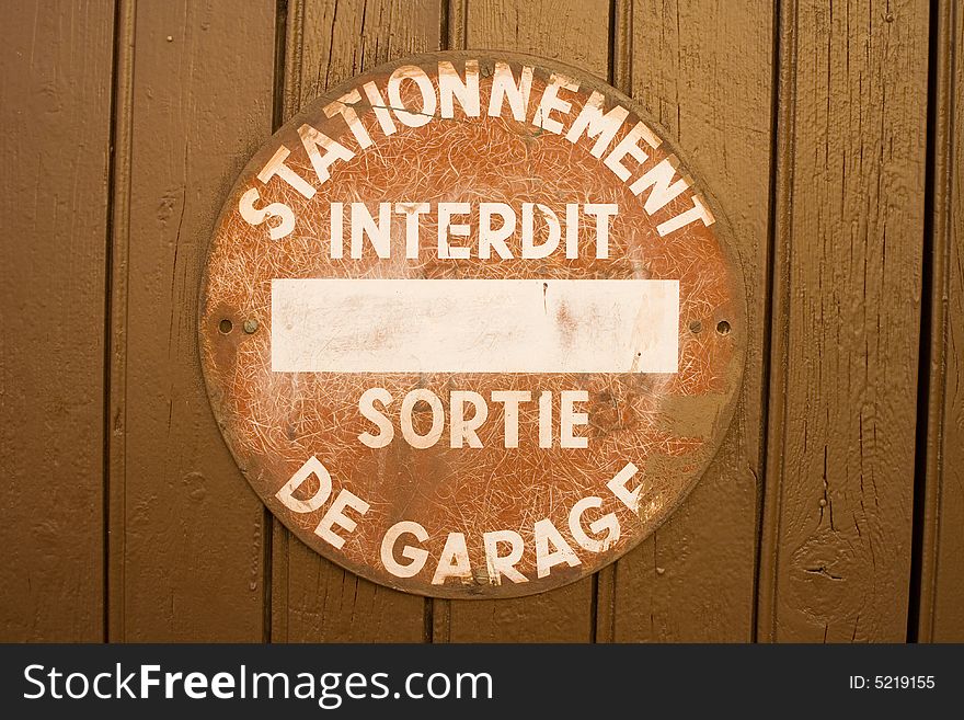 Forbidden sign at the door of a garage at the south of france)