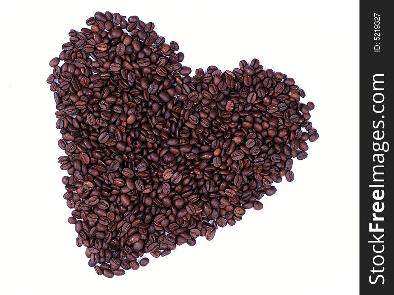 Heart made of coffee beans from above isolated