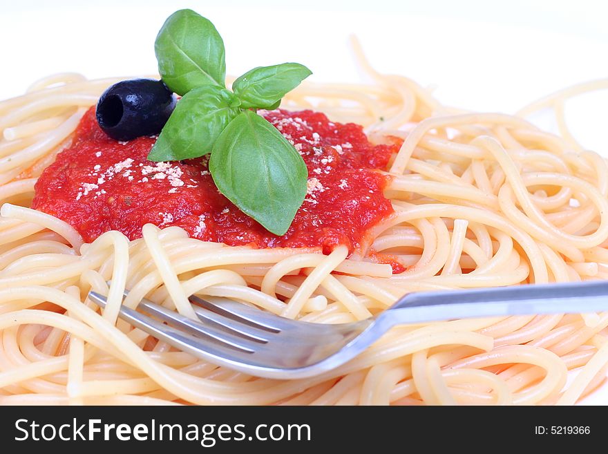 Pasta with tomato sauce basil and grated parmesan