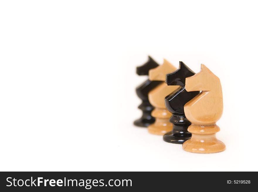 Black and white chess pieces isolated