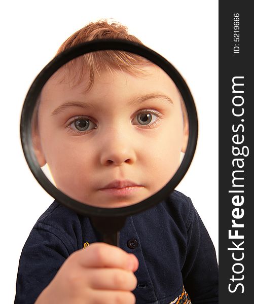 Child look through magnifier on white