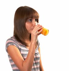 Girl Drinking Juice Stock Images