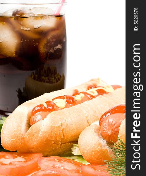 Hot dogs with vegetables and  a glass of cola  with ice isolated on a white background