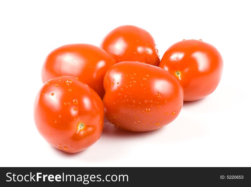 Fresh tomatoes with waterdrops isolated on a white background. Fresh tomatoes with waterdrops isolated on a white background.