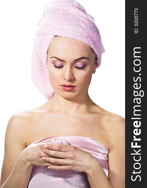 Beautiful woman wearing pink towel on her head