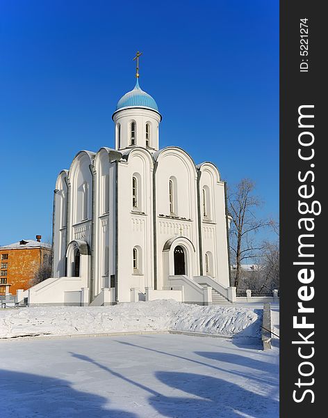 Small town Orthodox church in winter sunny day. Small town Orthodox church in winter sunny day