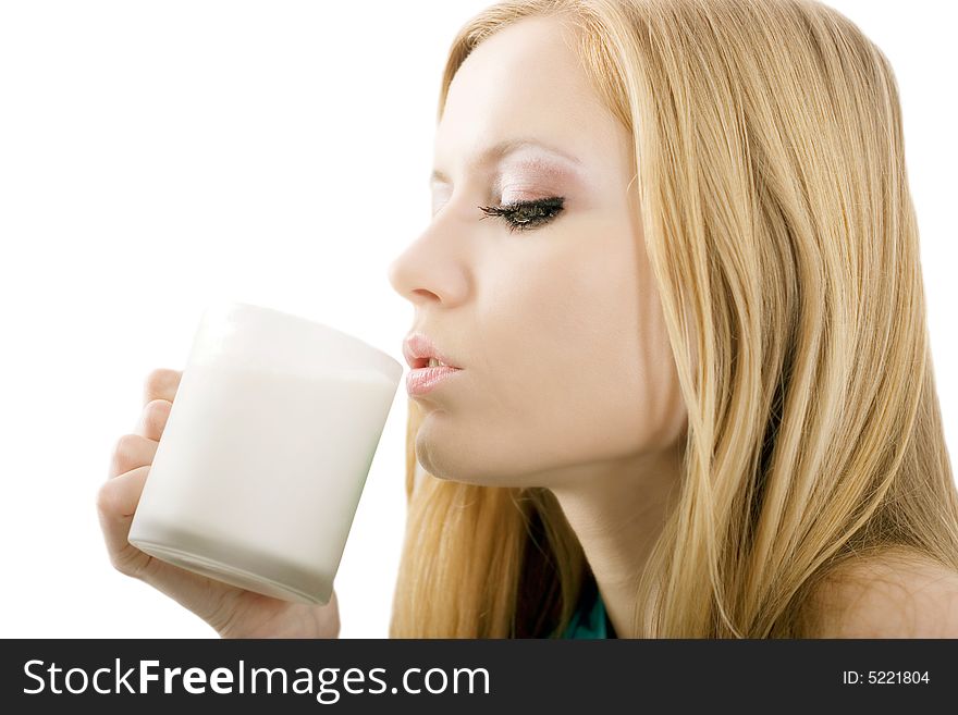 Cute blonde drinking a cup of milk on white background. Cute blonde drinking a cup of milk on white background