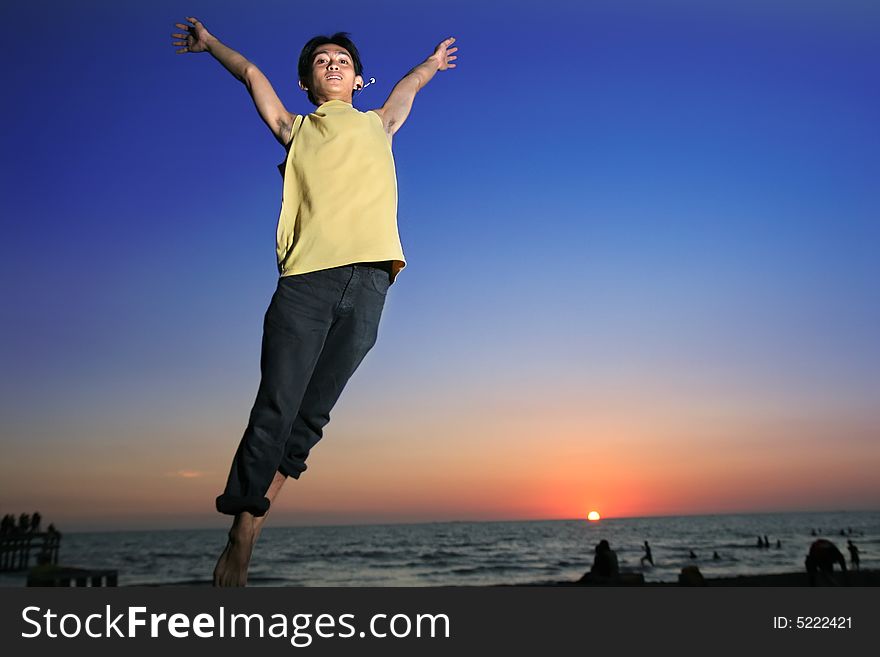 Exciting man in triopical sunset or sunrise. Exciting man in triopical sunset or sunrise