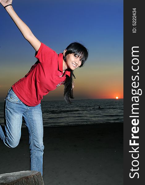 Photograph of asian girl in sunset