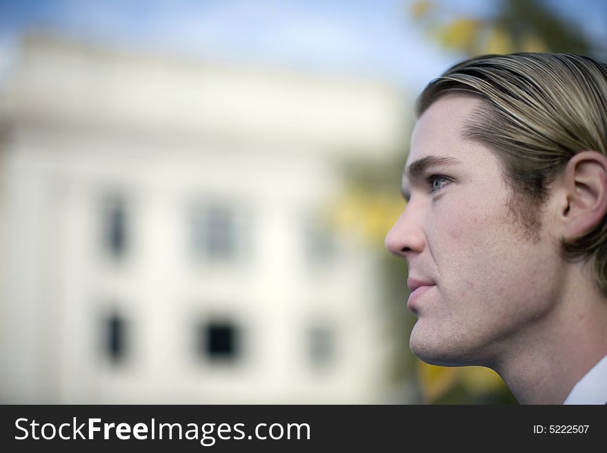 Profile view of young blond hair blue eye businessman