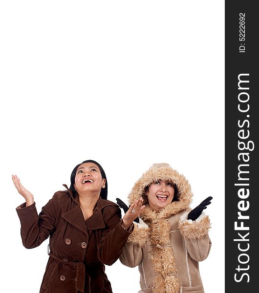 Women in wintercoat trying to catch something
