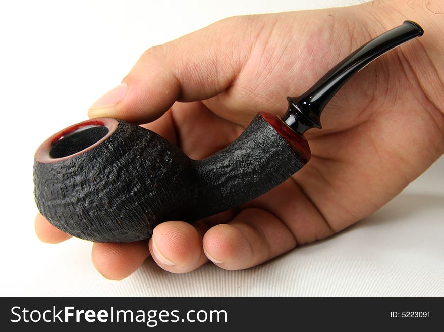 An tobacco pipe in my hand.