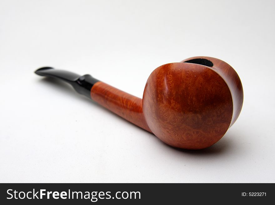 Only tobacco pipe isolated on white.