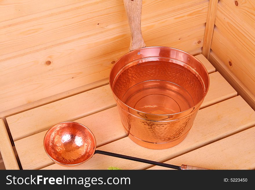 Bucket with water inside a Finnish sauna. Bucket with water inside a Finnish sauna