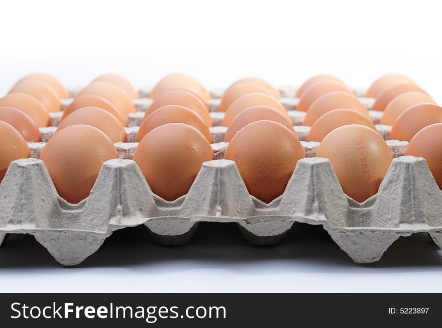 Eggs in a basket a over white background