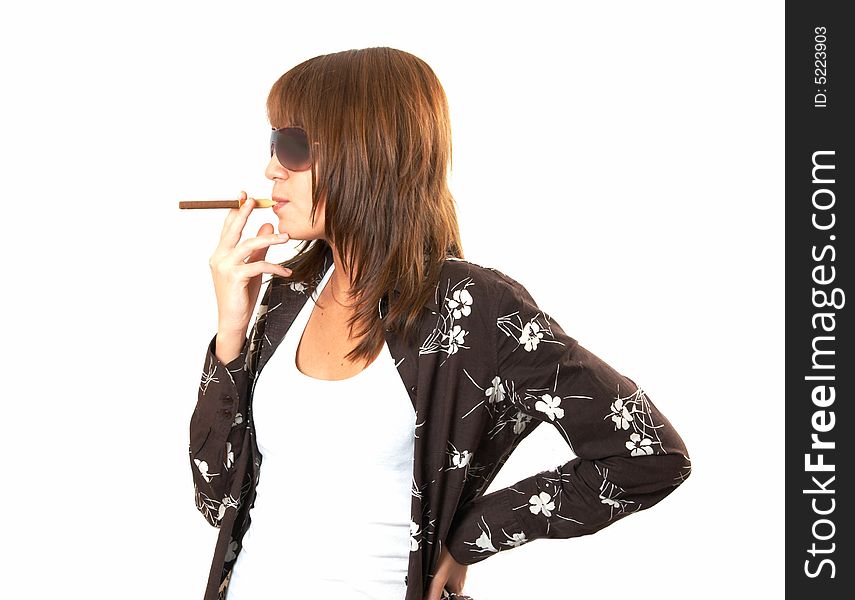 The girl in brown smoking a cigar. The girl in brown smoking a cigar